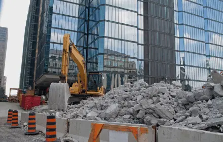 Commercial demolition crew removing interior concrete and steel in Toronto office building