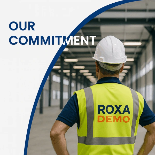 Roxa Demolition supervisor wearing safety gear inspecting an industrial demolition site – representing expertise and commitment to excellence